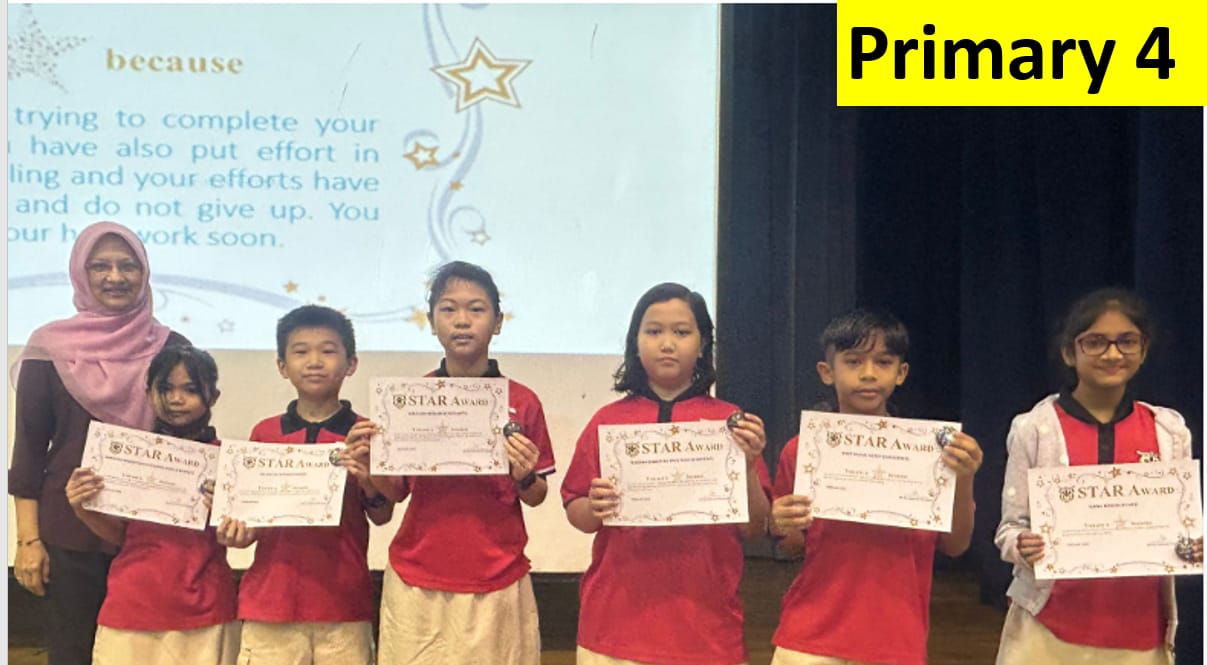 Six Primary 4 students hold Star Award certificates while standing with a teacher in front of a projected screen.